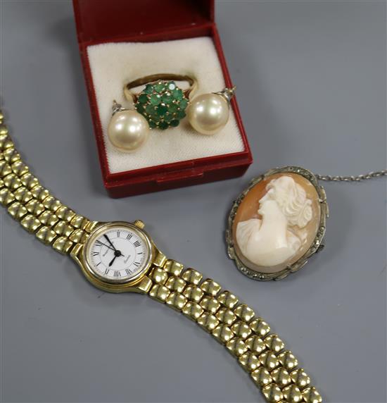 A ladys Mappin and Webb wrist watch, a yellow metal and emerald cluster dress ring, a cameo brooch and pair of ear studs.